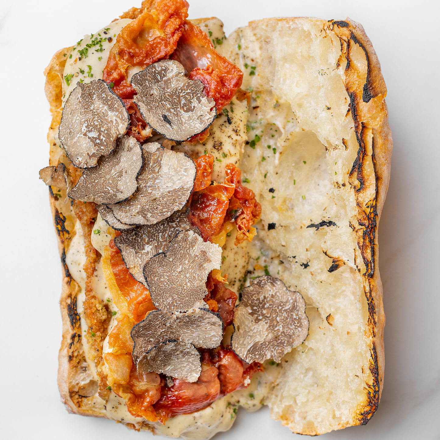 The Mona Lisa Cutlet Cacio e Pepe Black Truffle Sandwich by Ggiata